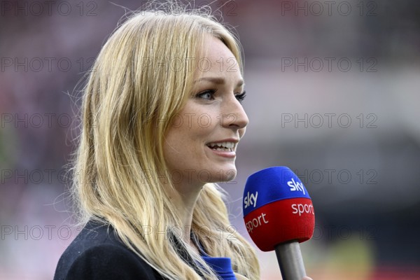 Presenter Sports presenter SKY Katharina Kleinfeldt in interview, microphone, mike, logo, Mercedes-Benz Arena, Stuttgart, Baden-Württemberg, Germany, Europe