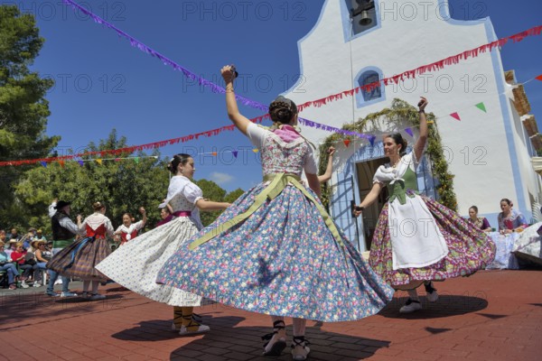 Women in traditional dress dance in front of the Ermita de San Vicent chapel, annual fiesta in honour of the saint of the same name in Cautivador or Captivador, La Nucía municipality, Alicante province, Valencia region, Costa Blanca, Spain, Europe