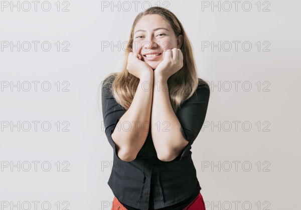 Cheerful and friendly girl face looking and smiling at the camera. Portrait of friendly latin girl smiling isolated. Young Nicaraguan woman smiling at camera