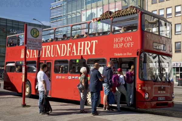 People boarding the red double-decker city tour bus, Hamburg, Germany, Europe