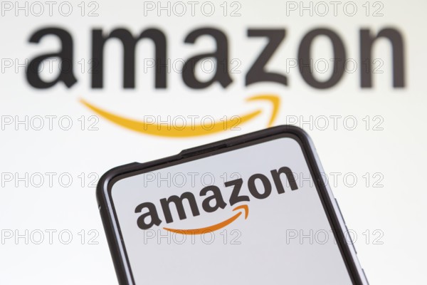 Amazon logo online marketplace online trading ecommerce on a mobile phone and computer screen