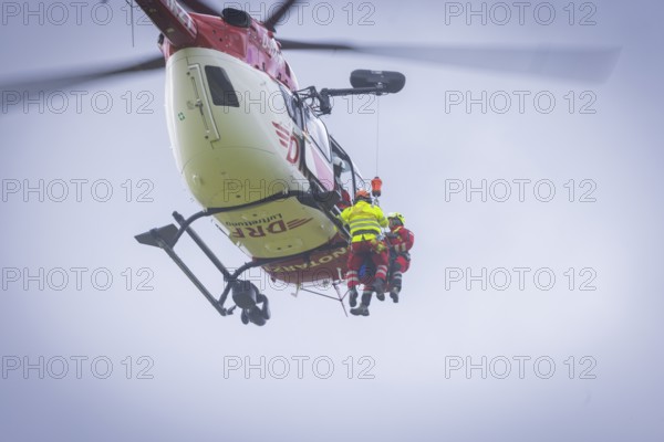 Winch rescue training of the rescue helicopter, Christoph 62, on the occasion of the 50th anniversary of the DRF Luftrettung. The rescue of casualties in the Elbe Sandstone Mountains will be practised