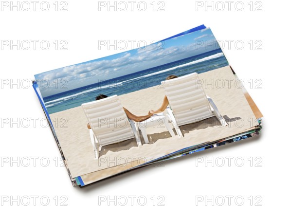 Holidays beach honeymoon concept creative background, stack of vacation photos with couple on beach image on top isolated on white background