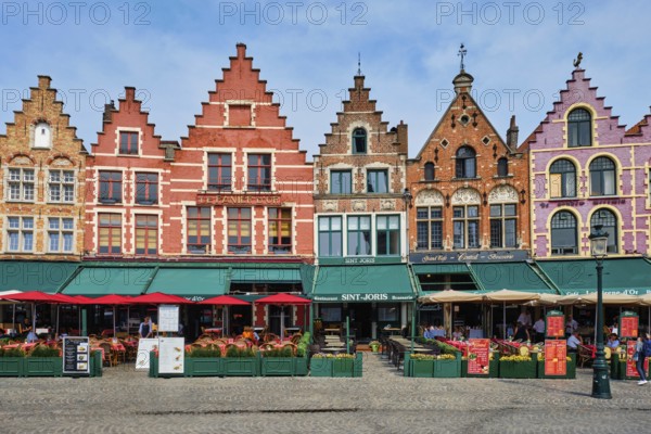 Bruges, Belgium, May 29, 2018: Bruges Grote markt square famous tourist place with many cafe and restaurants, Europe