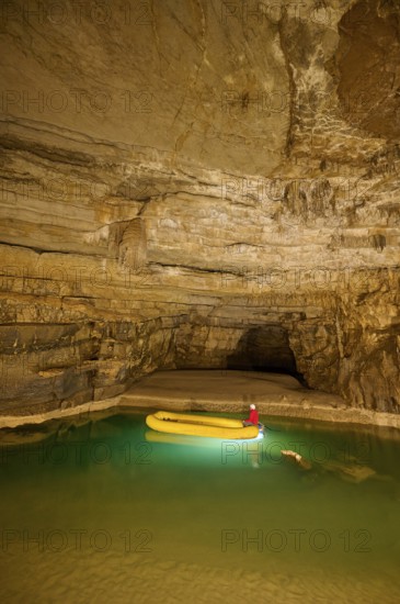 Karst cave, lake, rubber dinghy, speleologist, Krizna jama, Cerknica, Carniola, Slovenia, Europe