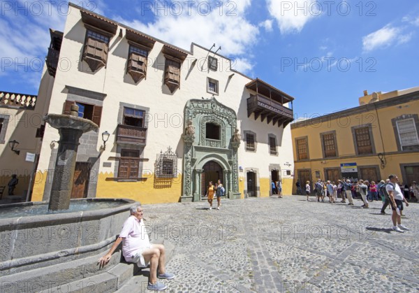 Columbus House at the Plaza del Pilar Nuevo, Las Palmas, Las Palmas Province, Gran Canaria, Canary Islands, Spain, fountain, sun, blue sky, tourists, Europe