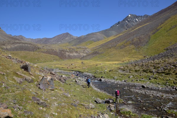 Hikers in the West Karakol Valley, Tien Shan Mountains, Naryn region, Kyrgyzstan, Asia