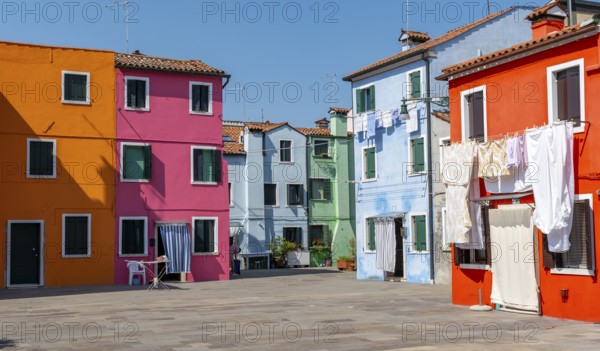 Colourful houses with washing lines, colourful house facades, alleyways on the island of Burano, Venice, Veneto, Italy, Europe