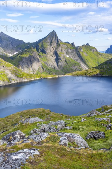 Mountain landscape with lake Tennesvatnet and rocky pointed mountain peak, at sunrise, Moskenesøya, Lofoten, Nordland, Norway, Europe