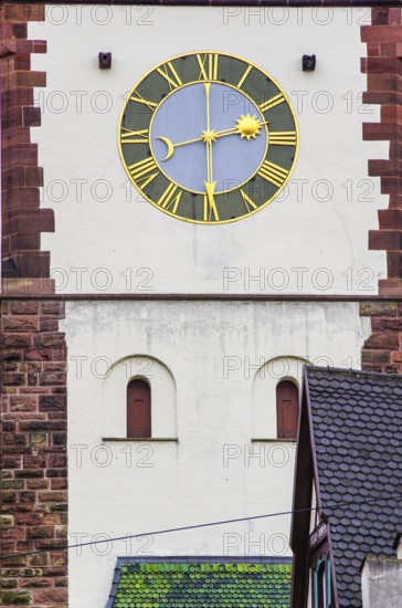 Old historic clock at the medieval Schwabentor, historic old town of Freiburg im Breisgau, Baden-Württemberg, Germany, Europe