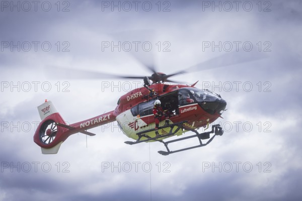 Winch rescue training of the rescue helicopter, Christoph 62, on the occasion of the 50th anniversary of the DRF Luftrettung. The rescue of casualties in the Elbe Sandstone Mountains will be practised