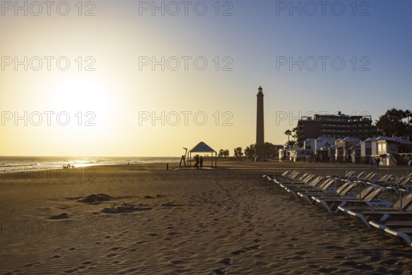 Sunset at the beach of Maspalomas with lighthouse Faro de Maspalomas, Gran Canaria, Canary Islands, Spain, Atlantic Ocean, Europe