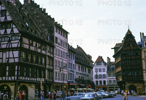 Historic medieval half-timbered buildings on the Place de la Cathedrale, city centre of Strasbourg, Alsace, France 1974