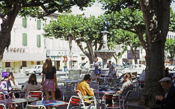 Street café in the shade of the trees in Pont Saint Esprit, Gard, France 1974