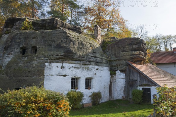 A house built into a rock, surrounded by autumn trees under a blue sky, rock dwelling, museum, Lhotka u Melníka, Melnik, Central Bohemia, Czech Republic, Europe