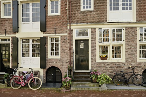 Bicycles in front of historic buildings, Herengracht 43, Amsterdam, Province of North Holland, Netherlands