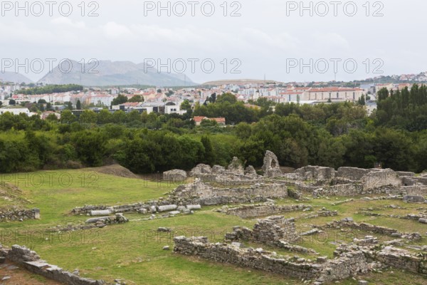 High angle view of old stone wall structures at ancient 3rd century Roman ruins of Salona near modern city of Solin in late summer, Croatia, Europe