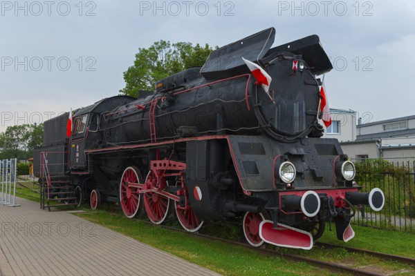 Front view of a black steam locomotive with red details in an open-air museum, Polish steam locomotive OL 49-11, railway museum, Elk, Elk, Lyck, Warmia-Masuria, Poland, Europe