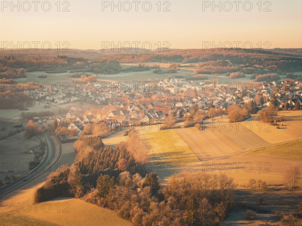 Rural village with surrounding fields at sunrise in autumnal atmosphere, Gechingen district Calw, Black Forest, Germany, Europe