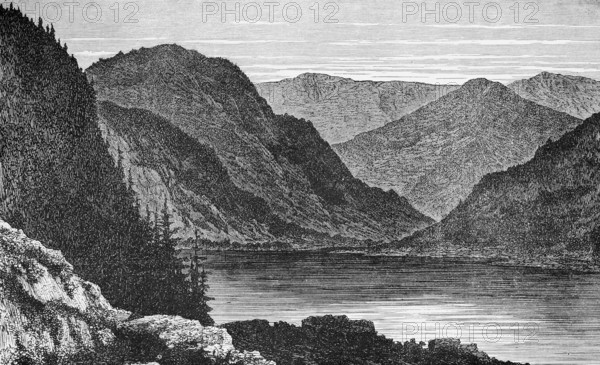 Titisee in the middle of a mountain landscape in the Black Forest nature park Park, Baden-Württemberg, fir vegetation, rocks, travel, Germany, historical illustration 1885, Europe