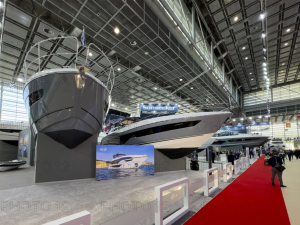 View of bow of Sunseeker luxury yachts superyachts ships boats in exhibition hall of public fair Messe boot Düsseldorf, Düsseldorf, North Rhine-Westphalia, Germany, Europe