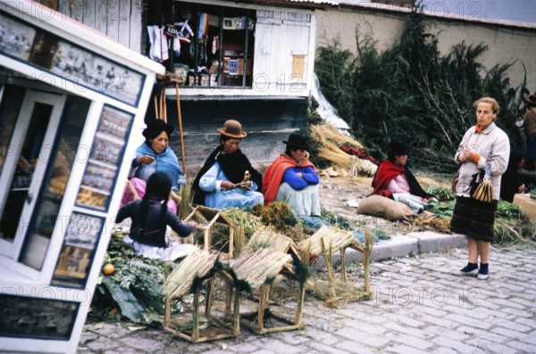 Women traders at the street market, city of La Paz, Bolivia, South America, British tourist standing Caption Christmas Eve in La Paz 1962, South America