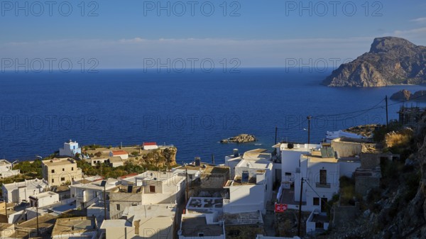 White village by the sea with views of the coast and the ocean, Mesochori village, west coast, Karpathos, Dodecanese, Greek Islands, Greece, Europe