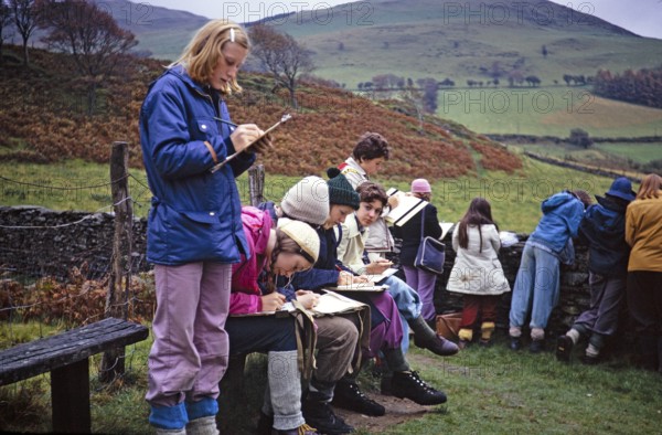 Secondary school girls doing fieldwork in geography, Great Britain 1970s Girls doing fieldwork, making observations and notes 1974