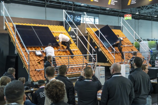 Presentation of the rapid installation of a solar system on a residential house with a pitched roof, in the form of a competition, European Solar Games, at the Solar Solutions Düsseldorf trade fair, over 250 international exhibitors present products and services from the solar industry, smart storage, EV charging and green HVAC to a trade audience of users and dealers, Düsseldorf, North Rhine-Westphalia, Germany, Europe