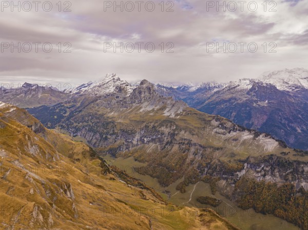 Rugged mountains with snowy peaks and wide valley views under a partly cloudy sky, Alpen Tower, Switzerland, Europe