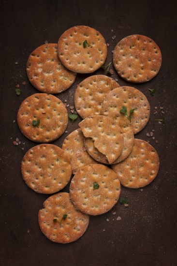 Crispbread, round, with salt and herbs, top view, food concept, no people