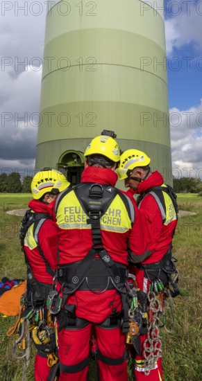 Height rescuers from the Gelsenkirchen fire brigade practise abseiling from a wind turbine from a height of 110 metres after rescuing an accident victim from the nacelle, Gladbeck, North Rhine-Westphalia, Germany, Europe