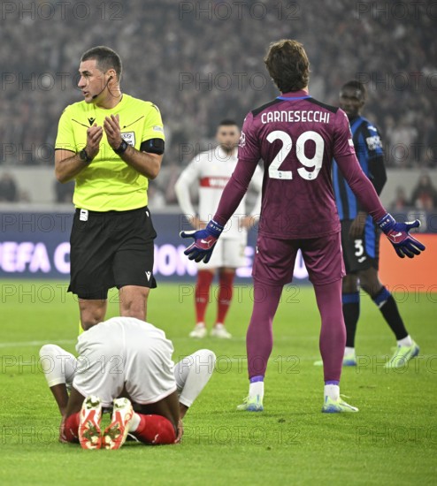 Referee Referee Rade Obrenovic (SVN) Gesture Gesture only ball played, no foul, goalkeeper Marco Carnesecchi Atalanta BC Bergamo (29) Gesture Gesture reproachful against Odilon Kossounou Atalanta BC Bergamo (03) Champions League, MHPArena, MHP Arena Stuttgart, Baden-Württemberg, Germany, Europe