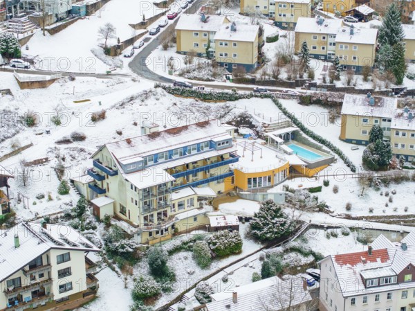 Aerial view of a snowy town with colourful houses and mountainous terrain, Bad Wildbad, Black Forest, Germany, Europe