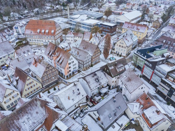 Snow-covered roofs and half-timbered houses in a historic town centre, Nagold, Black Forest, Germany, Europe