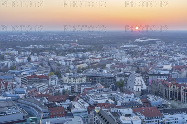 View of the city from the City Tower at sunset, St Thomas' Church, Red Bull Arena and Auwald forest, Leipzig, Saxony, Germany, Europe