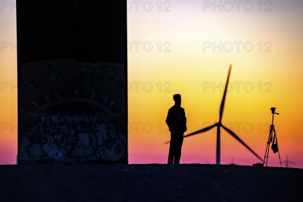 Sculpture by Richard Serra, Bramme for the Ruhr area on the Schurenbach spoil tip, photographer, selfie, wind turbine, in Essen, Germany, Europe