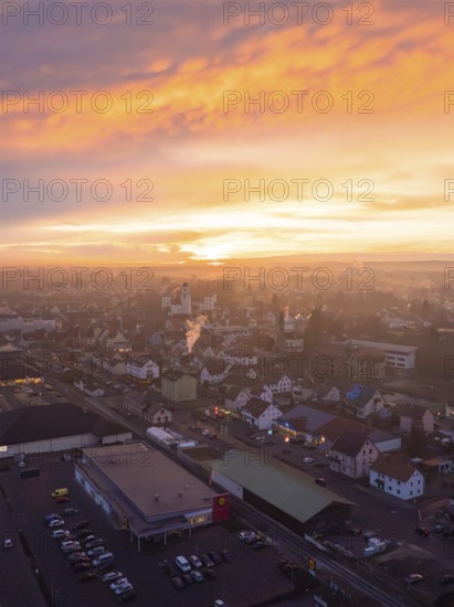 Cityscape under a spectacular sunset with pink and orange sky, Meßkirch, district of Sigmaringen, Germany, Europe