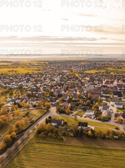 Bird's eye view of a small town with autumnal colours in a wide landscape, Jettingen, Black Forest, Germany, Europe