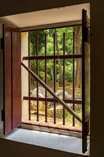 Open window of old colonial house with patio and garden in the historic city of Olinda, Olinda, Pernambuco, Brazil, South America