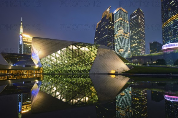 GUANGZHOU, CHINA, APRIL 27, 2018: Guangzhou Opera House designed by famous Iraqi architect architect Zaha Hadid illluminated at night