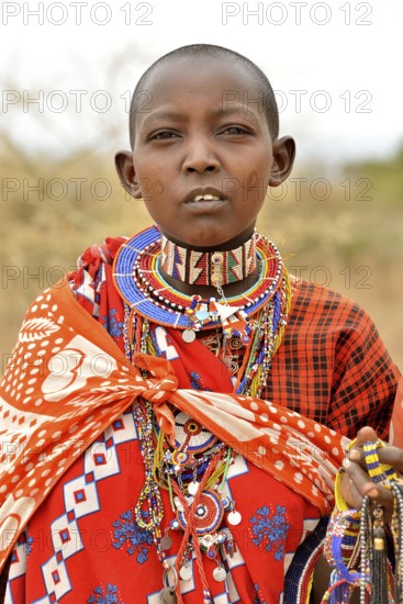 Maasai woman wearing traditional costume, Amboseli National Park, Rift Valley Province, Kenya, Africa