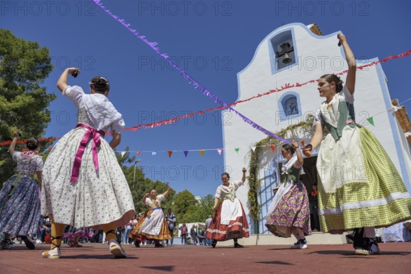 Women in traditional dress dance in front of the Ermita de San Vicent chapel, annual fiesta in honour of the saint of the same name in Cautivador or Captivador, La Nucía municipality, Alicante province, Valencia region, Costa Blanca, Spain, Europe