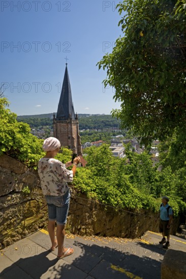 Elevated view from the Schlossberg to the church tower of St. Marien and the steep staircase into the town, Marburg an der Lahn, Hesse, Germany, Europe