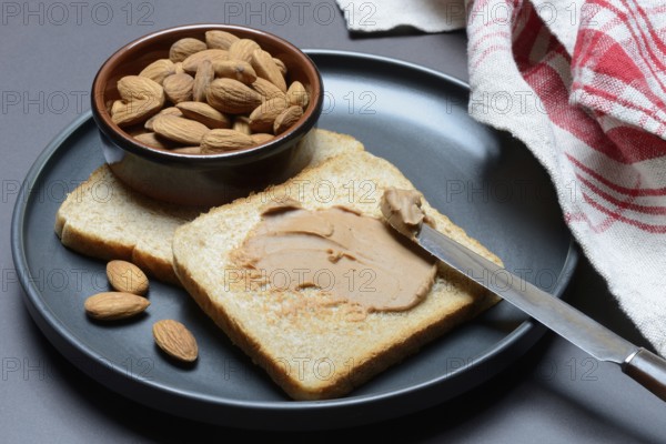 Toast with almond cream and almond shell, spread