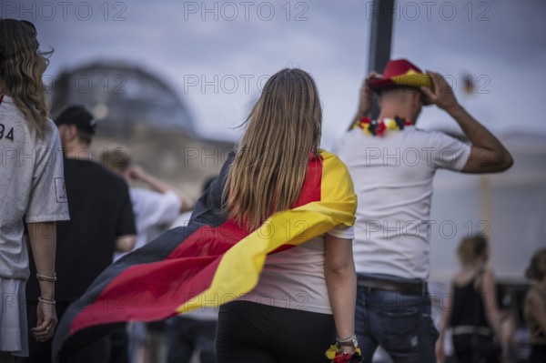 Scenes in the fan zone on Platz der Republik in front of the Reichstag building taken in Berlin, 29 June 2024 during the broadcast of the football match between Denmark and Germany