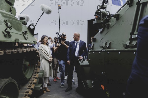 (L-R) Annalena Bärbock (Bündnis 90/Die Grünen), Federal Foreign Minister, and Dennis Buerjes, Managing Director of FFG Industries, during a visit to Flensburger Fahrzeugbau GmbH during the Foreign Minister's trip to Germany in Flensburg, 25 July 2024. /