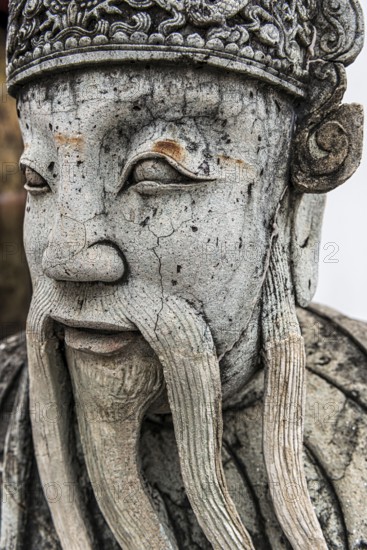 Stone sculpture in Wat Pho temple, head, face, weathered, Buddhism, religion, world religion, sculpture, sculpting, art, statue, garden, culture, believing, faith, peace, park, asian, stone, beard, man, male, travel, holiday, tourism, guard, guardian, representation, tradition, traditional, decoration, Bangkok, Thailand, Asia