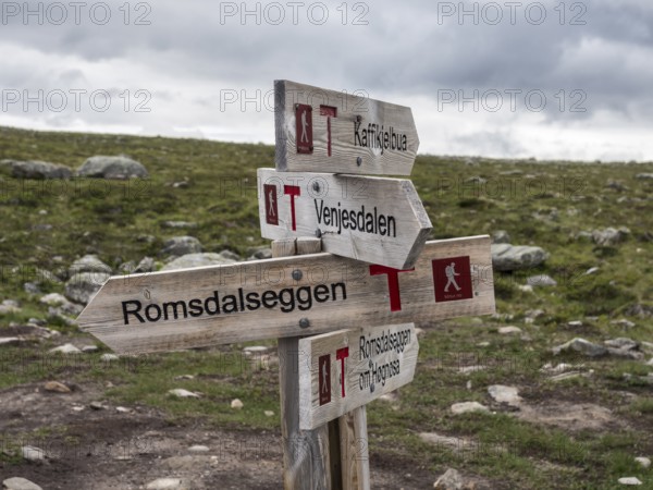 Signpost at trail to mountain ridge Romsdalseggen, famous hiking trip near Andalsnes, Norway, Europe