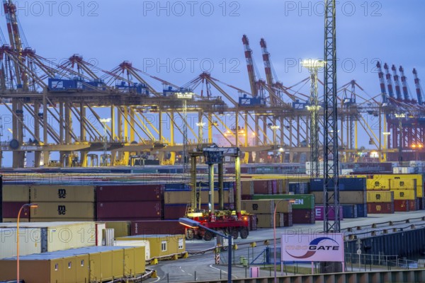 Container terminal in the seaport of Bremerhaven, Eurogate Container Terminal with almost 50 container gantry cranes, cranes, on a length of over 4 KM at the mouth of the Weser, straddle carriers bring the containers to and from the container ships, or store them between, Bremerhaven, Bremen, Germany, Europe